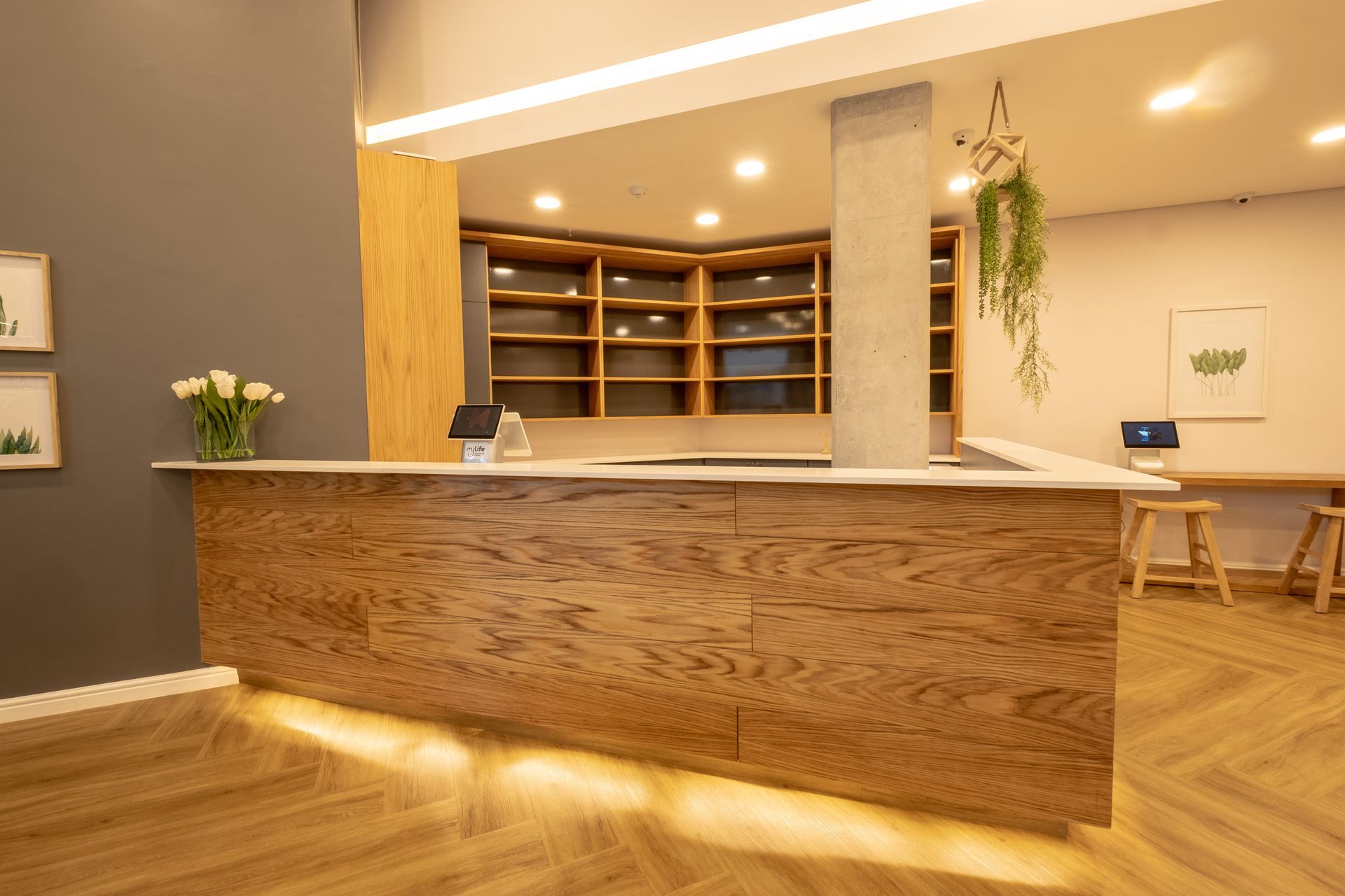 There is a wooden counter in the middle of the room.