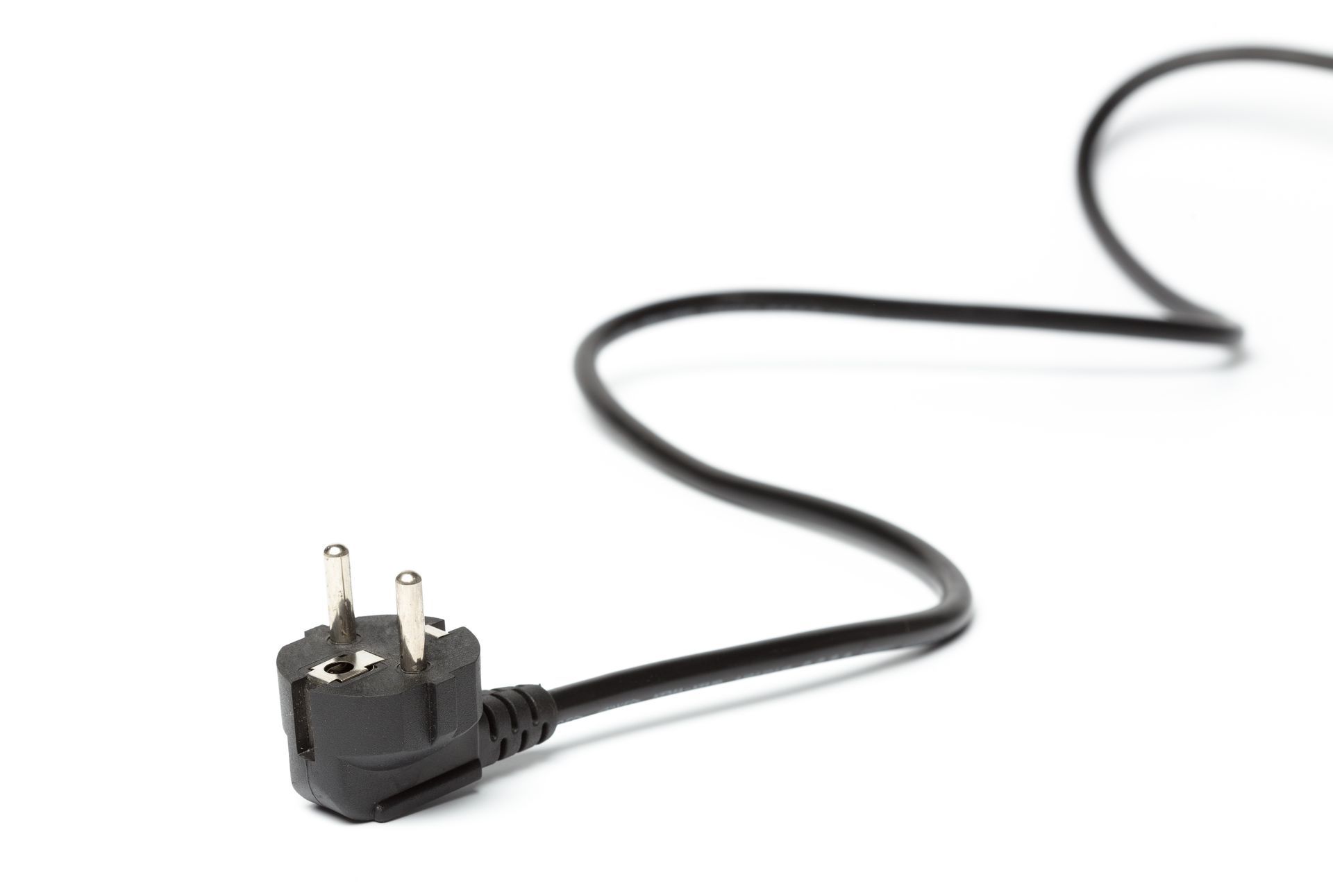 Black electrical plug with two prongs and a grounding pin, on a white background.