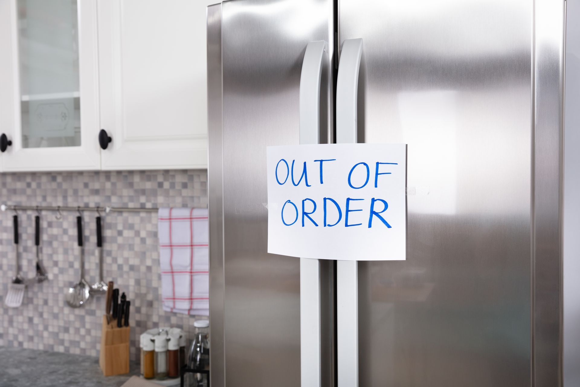 Stainless steel refrigerator with a handwritten Stainless steel refrigerator with a handwritten