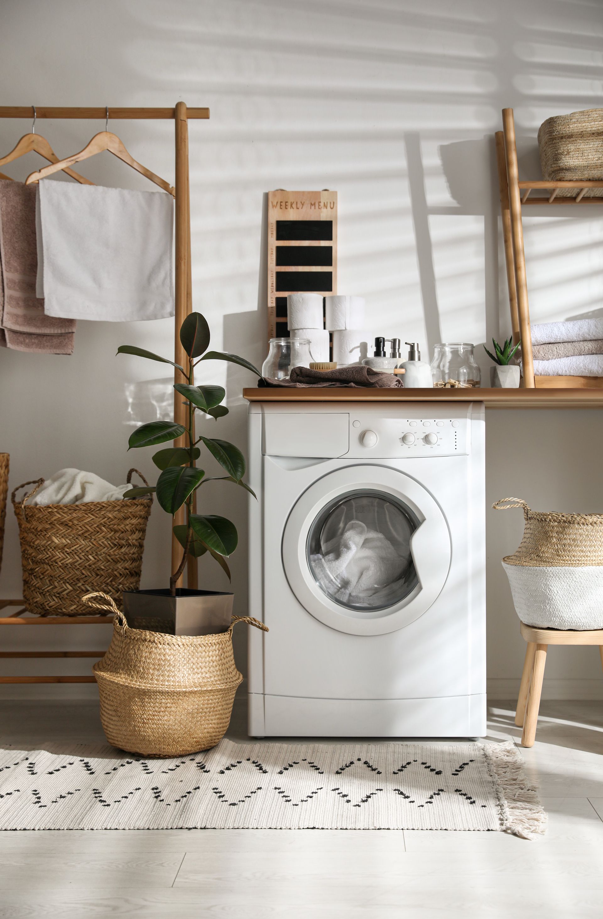 Stylish bathroom interior with modern washing machine Stylish bathroom interior with modern washing machine