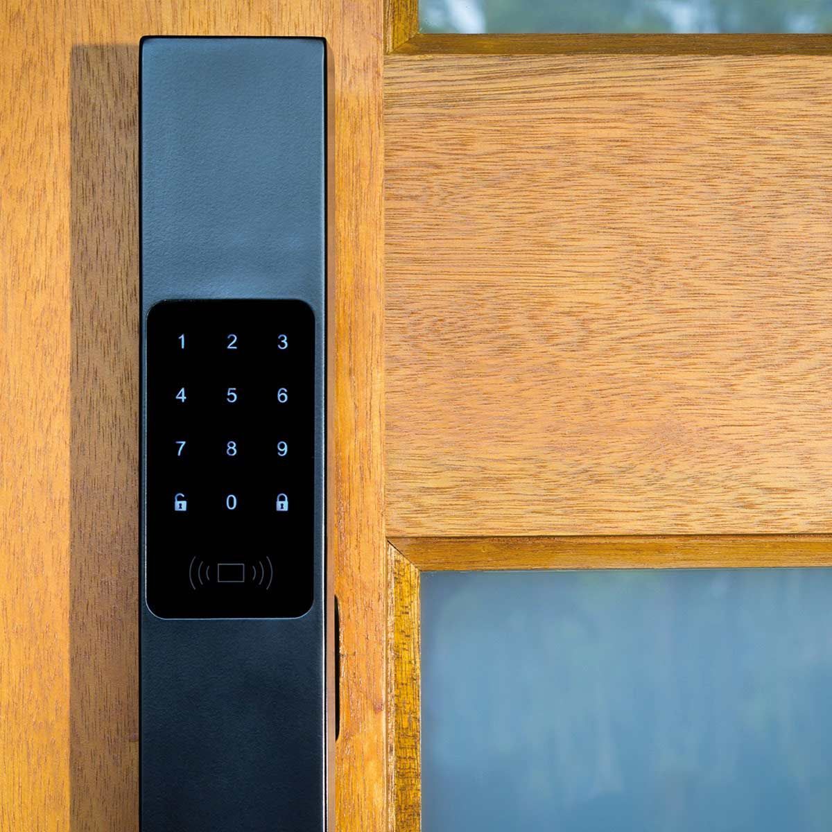 A Close Up of a Keypad on a Wooden Door — SPL Security Solutions In Robina, QLD
