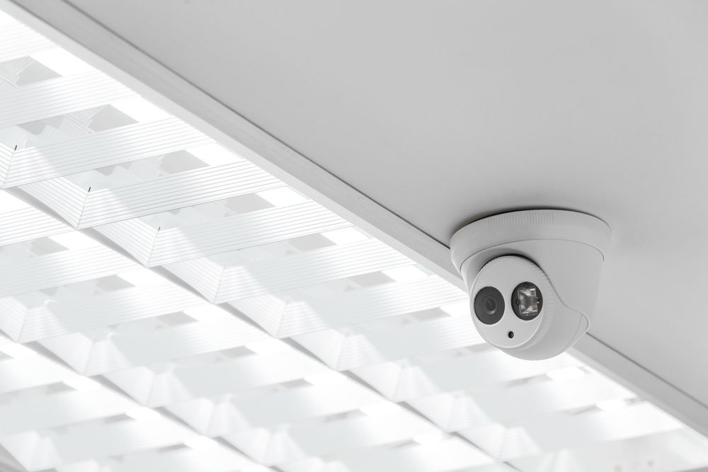 A Security Camera Is Mounted On The Ceiling Of A Building — SPL Security Solutions In Coolangatta, QLD
