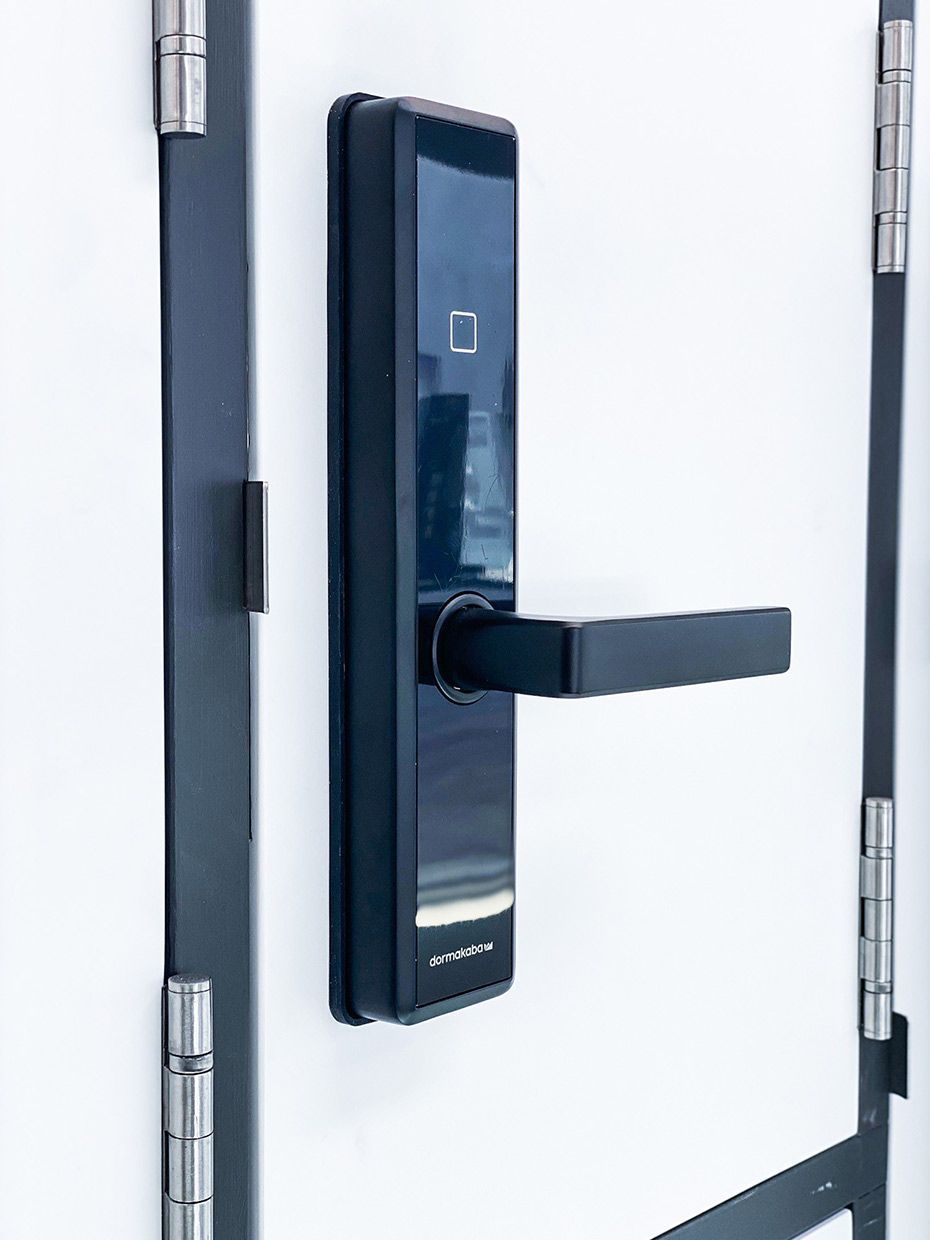A Close Up of a Digital Door Lock on a White Door — SPL Security Solutions In Runaway Bay, QLD