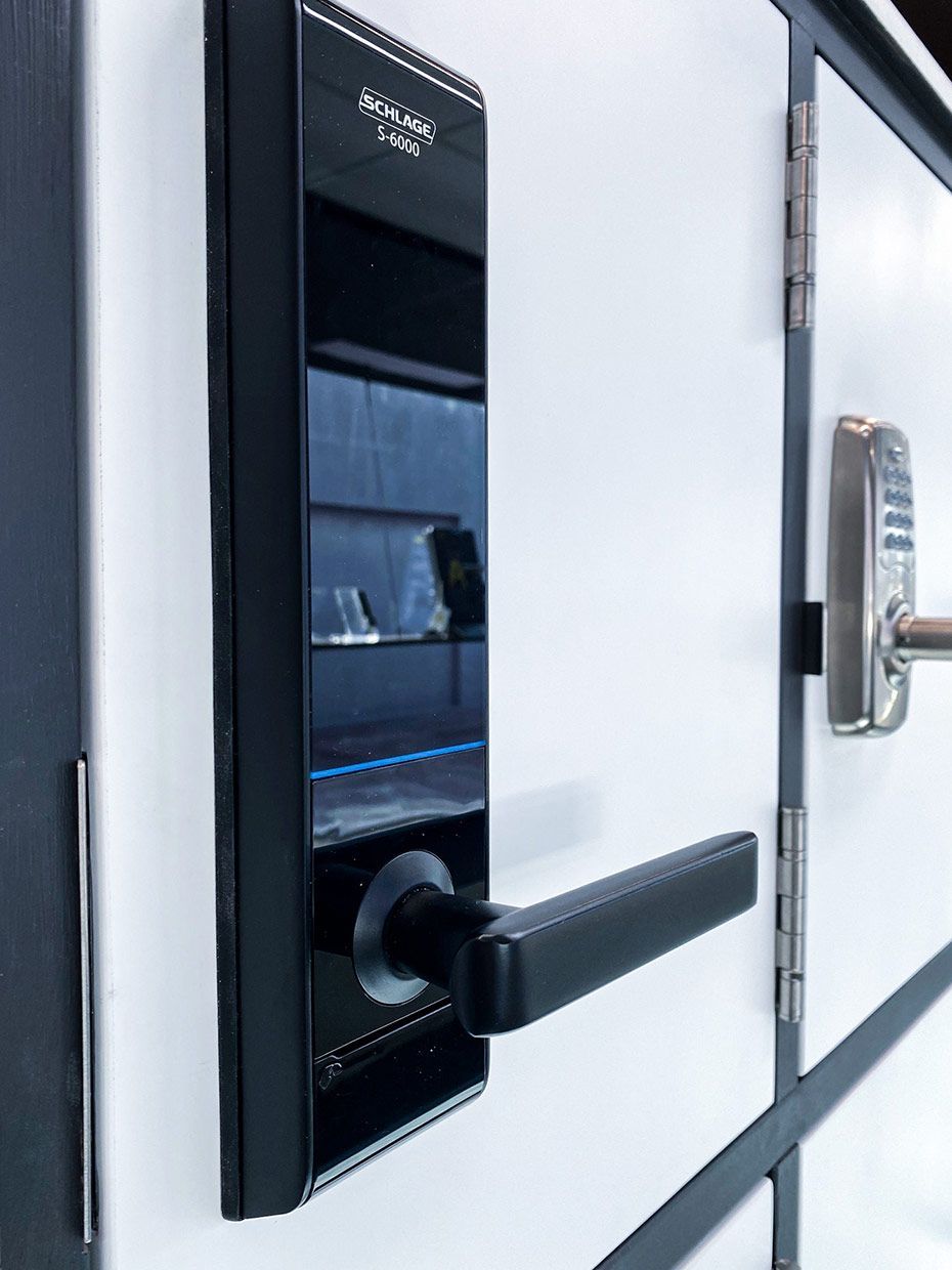 A Close Up of a Door Lock on a White Door — SPL Security Solutions In Tweed Heads, NSW