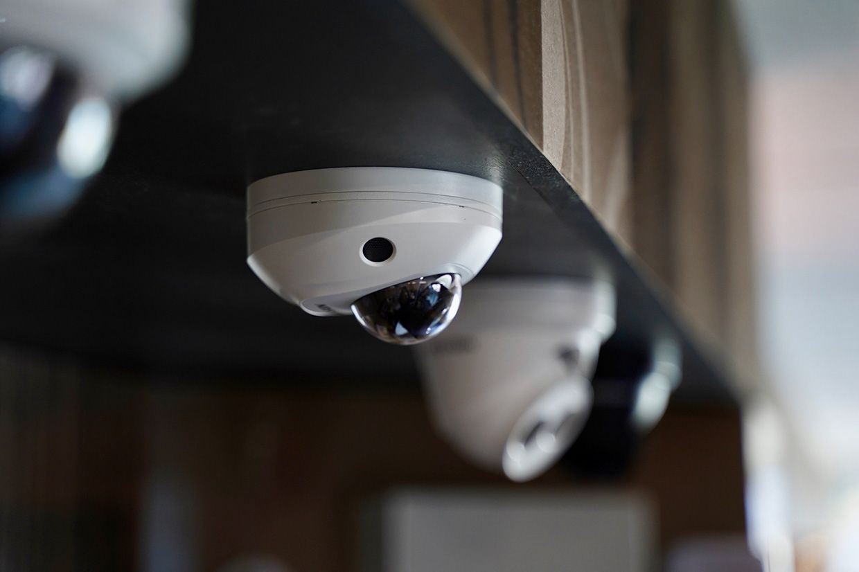 A Row of Security Cameras Hanging From the Ceiling of a Building — SPL Security Solutions In Gold Coast, QLD