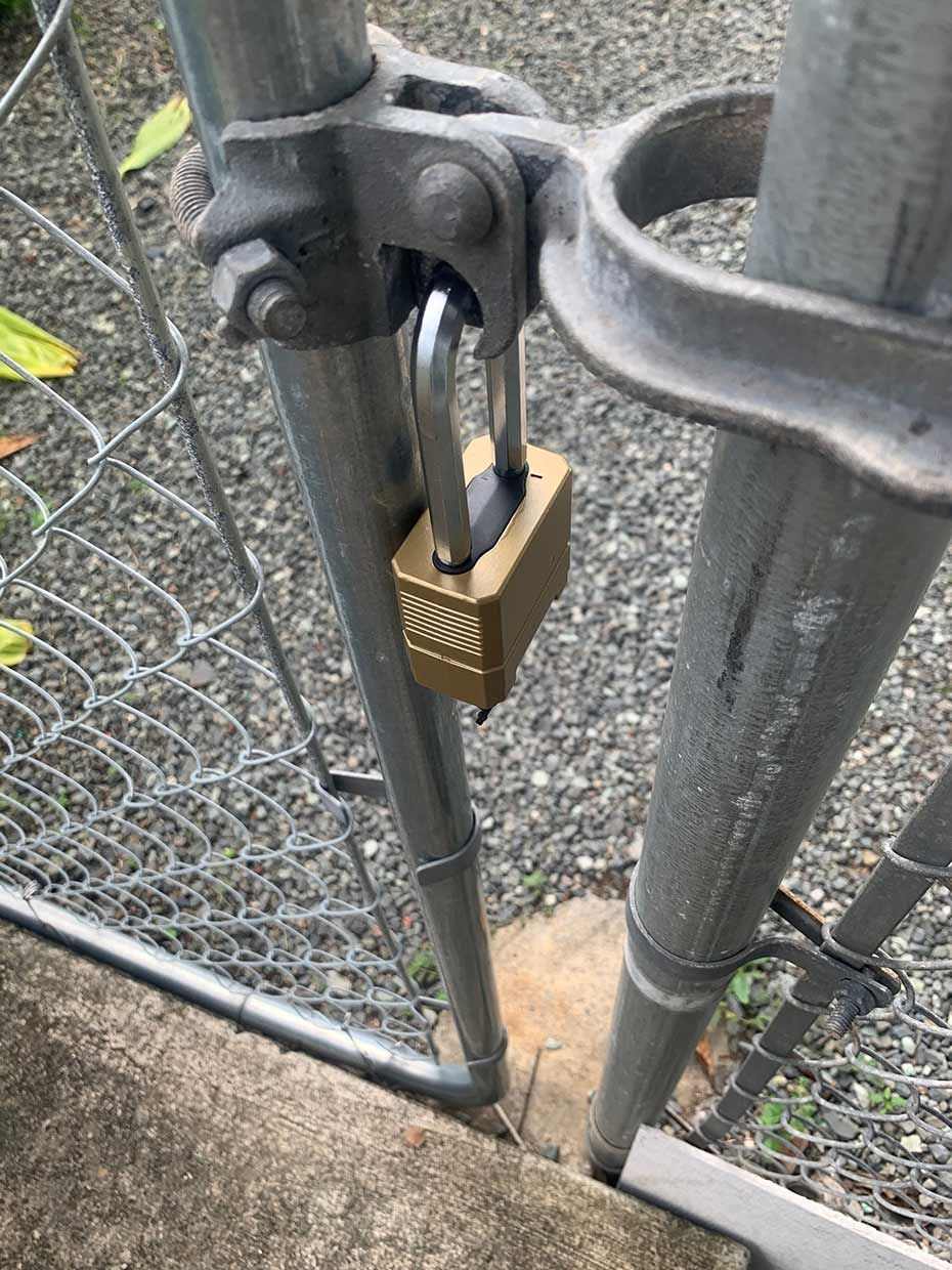 A Close Up of a Padlock on a Chain Link Fence — SPL Security Solutions In Mermaid, QLD