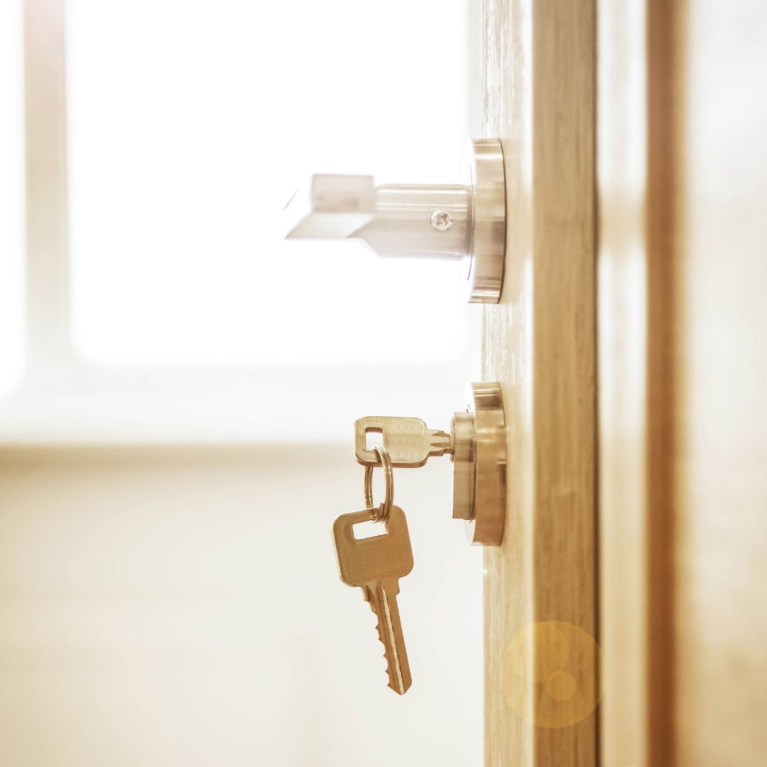 A Close Up of a Door With a Key in the Lock — SPL Security Solutions In Yatala, QLD