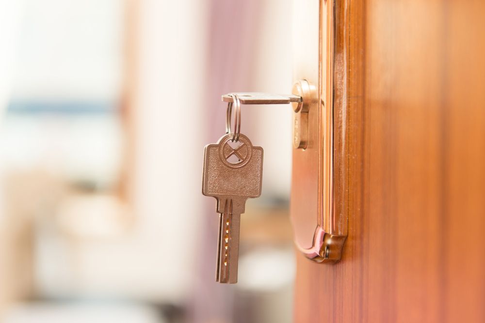 A Close Up Of A Key In A Door Lock — SPL Security Solutions In Northern, NSW