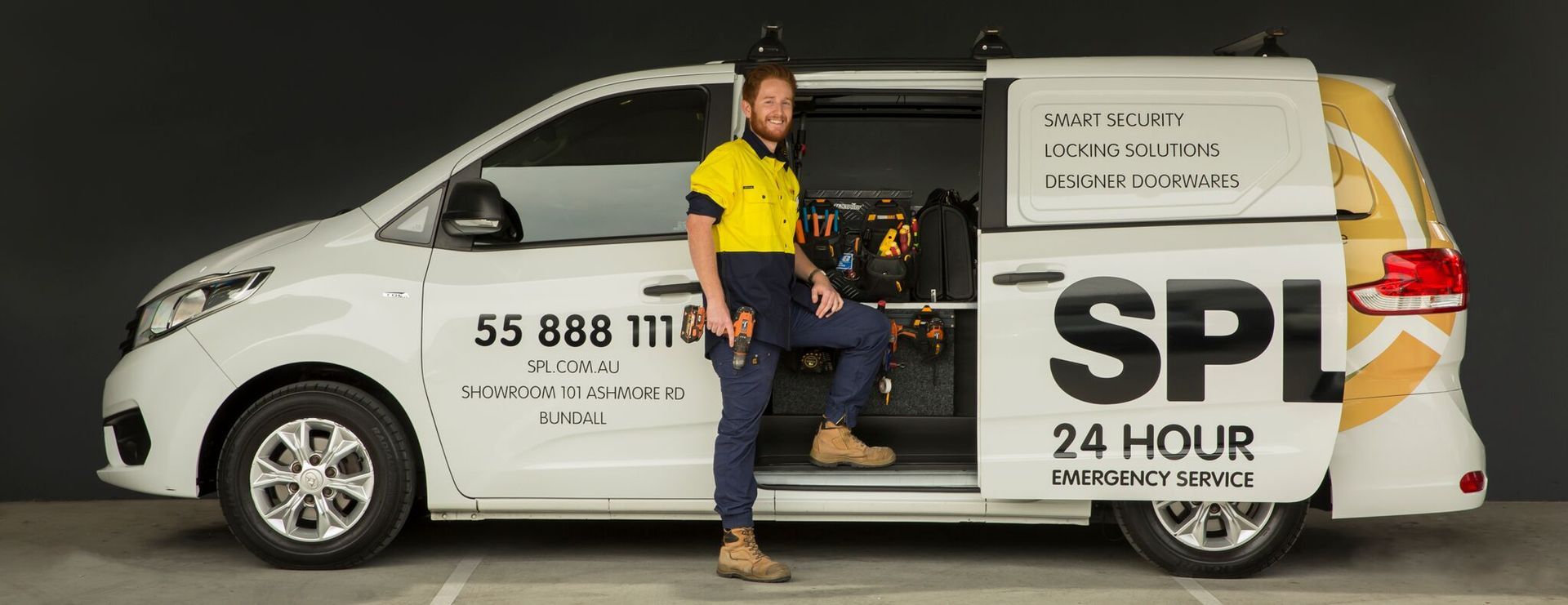 Locksmith Standing in Front of Locksmith Van — SPL Security Solutions In Bundall, QLD
