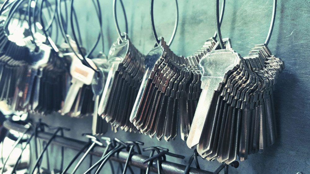 A Bunch Of Keys Are Hanging On A Rack — SPL Security Solutions In Coomera, QLD