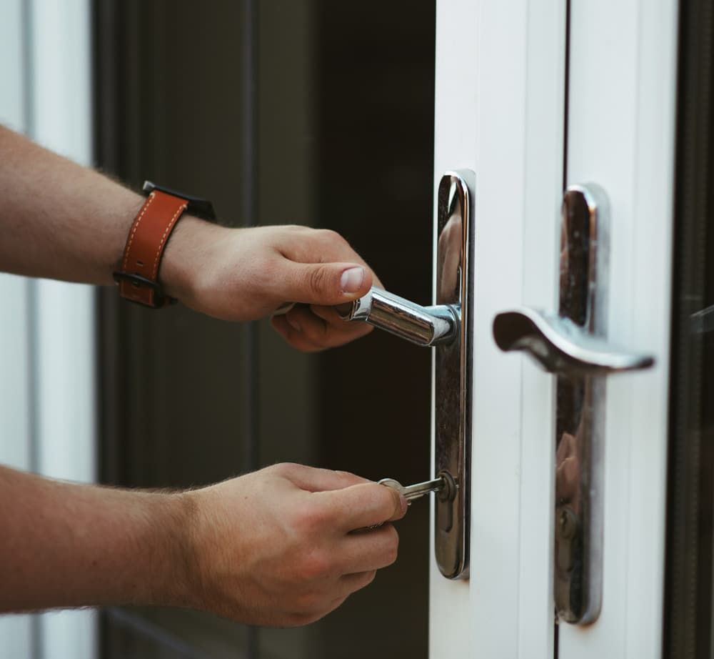 Close Up of Locksmith Unlocking Door — SPL Security Solutions In Bundall, QLD