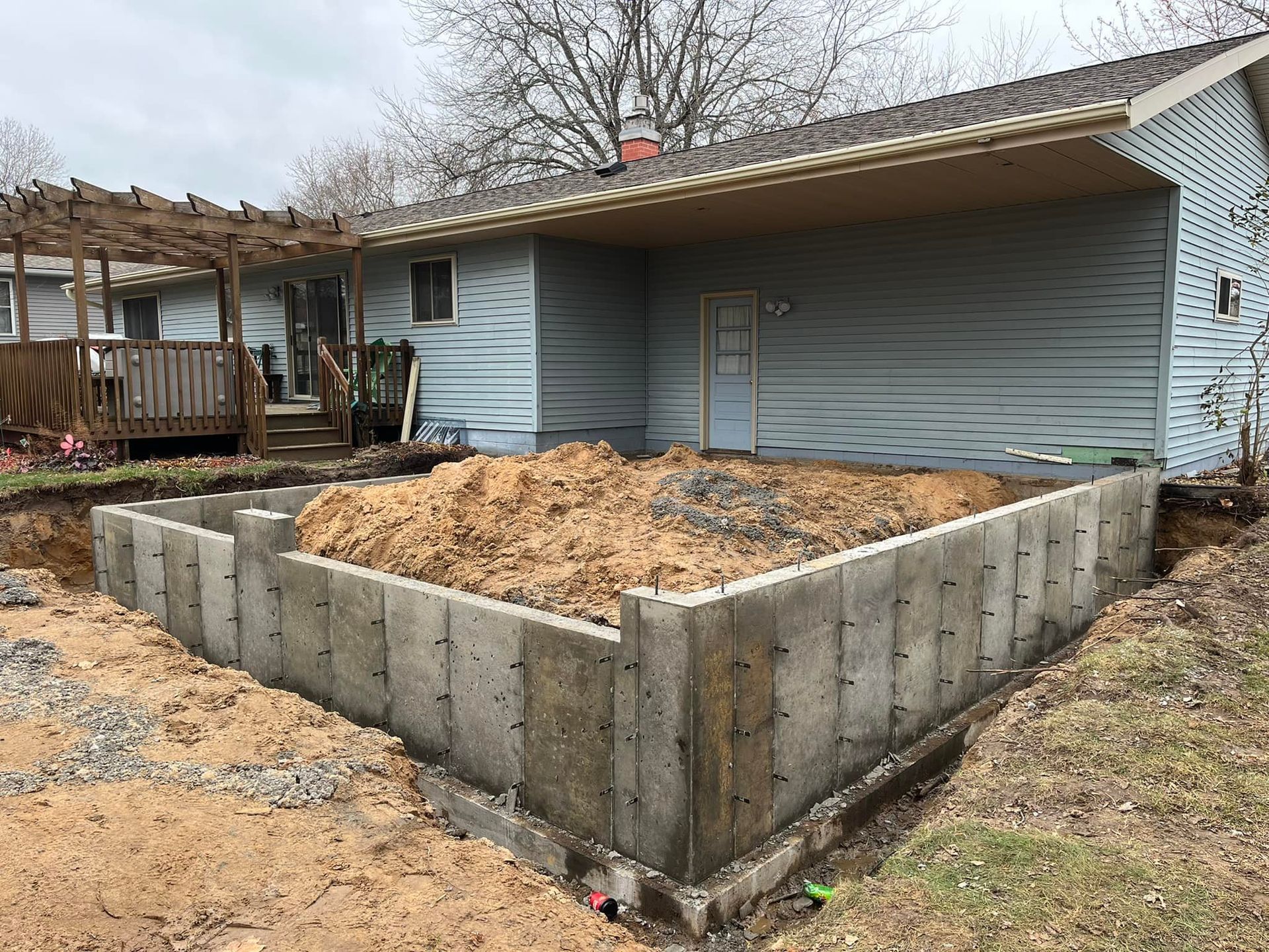 A house is being built with a concrete base.