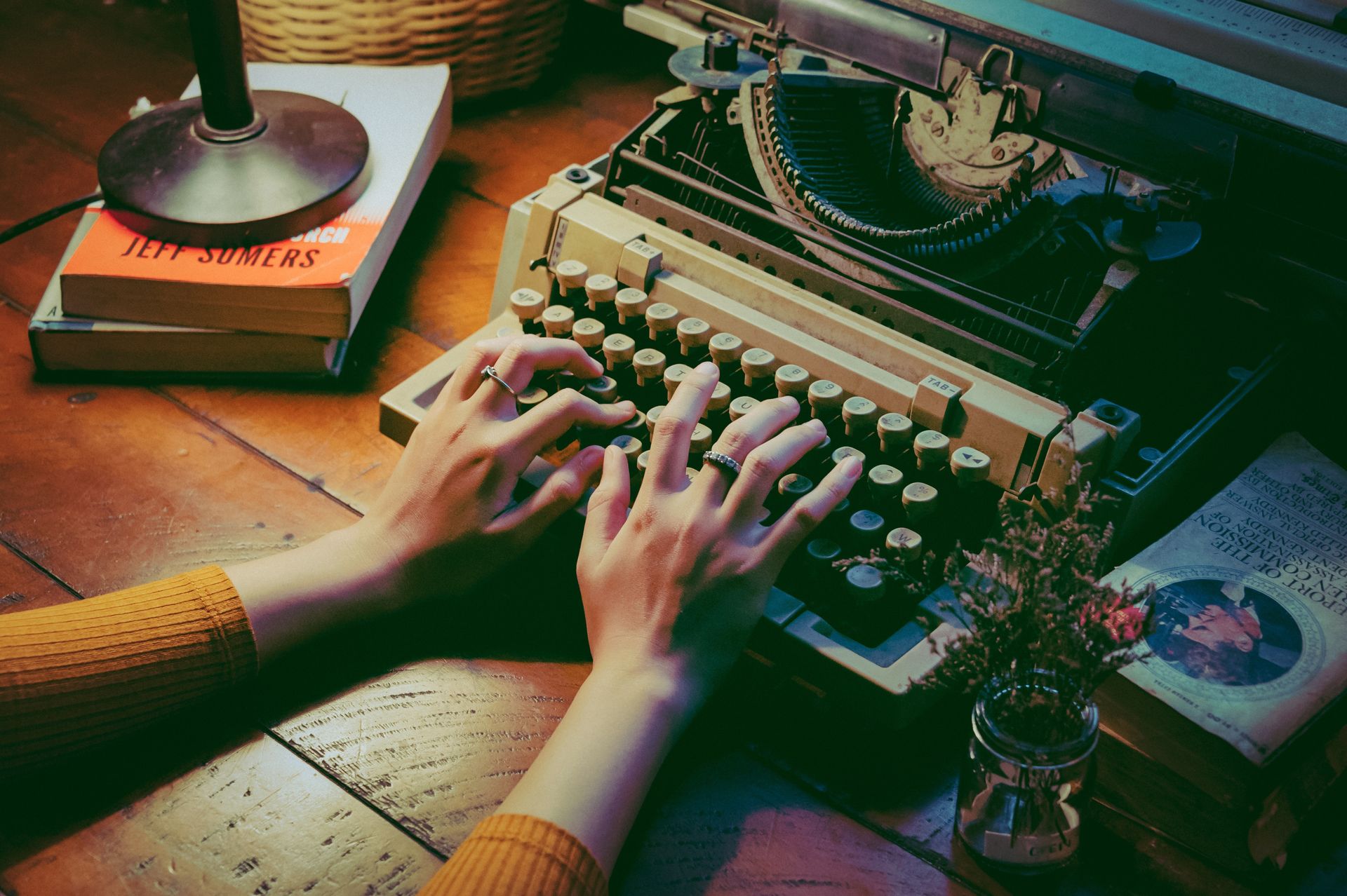writer typing on typewriter