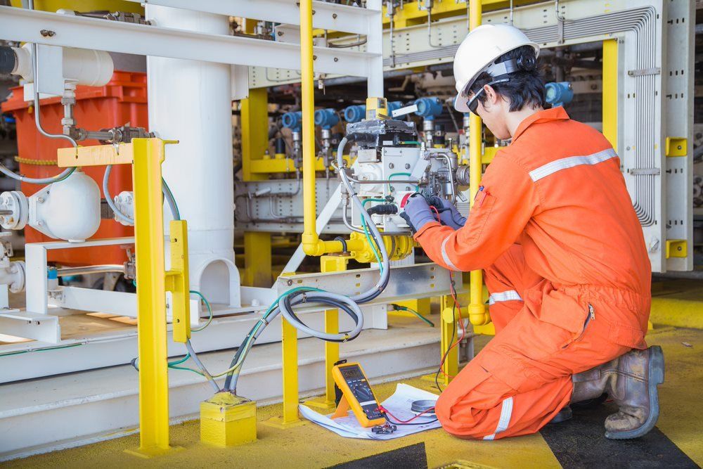 Man Working On Electrical System In Mines — Barnes Electrical in Gladstone, QLD