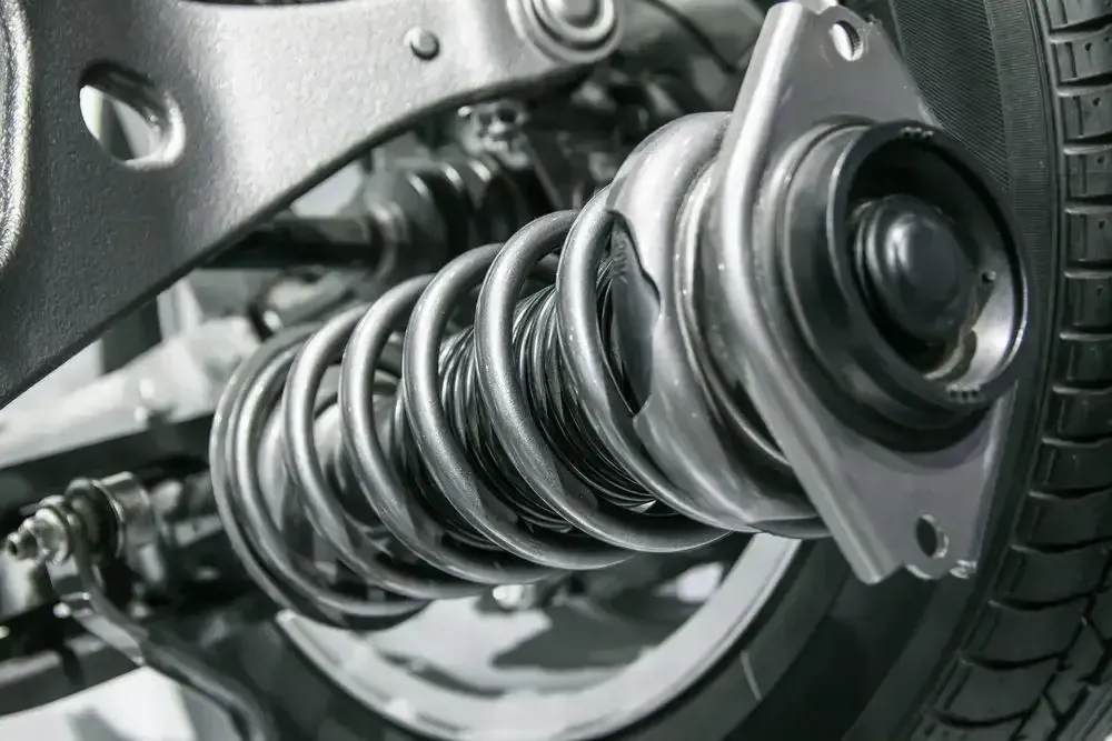 A Close Up Of A Shock Absorber On A Car — Deri's Mobile Mechanical In Palmerston, NT