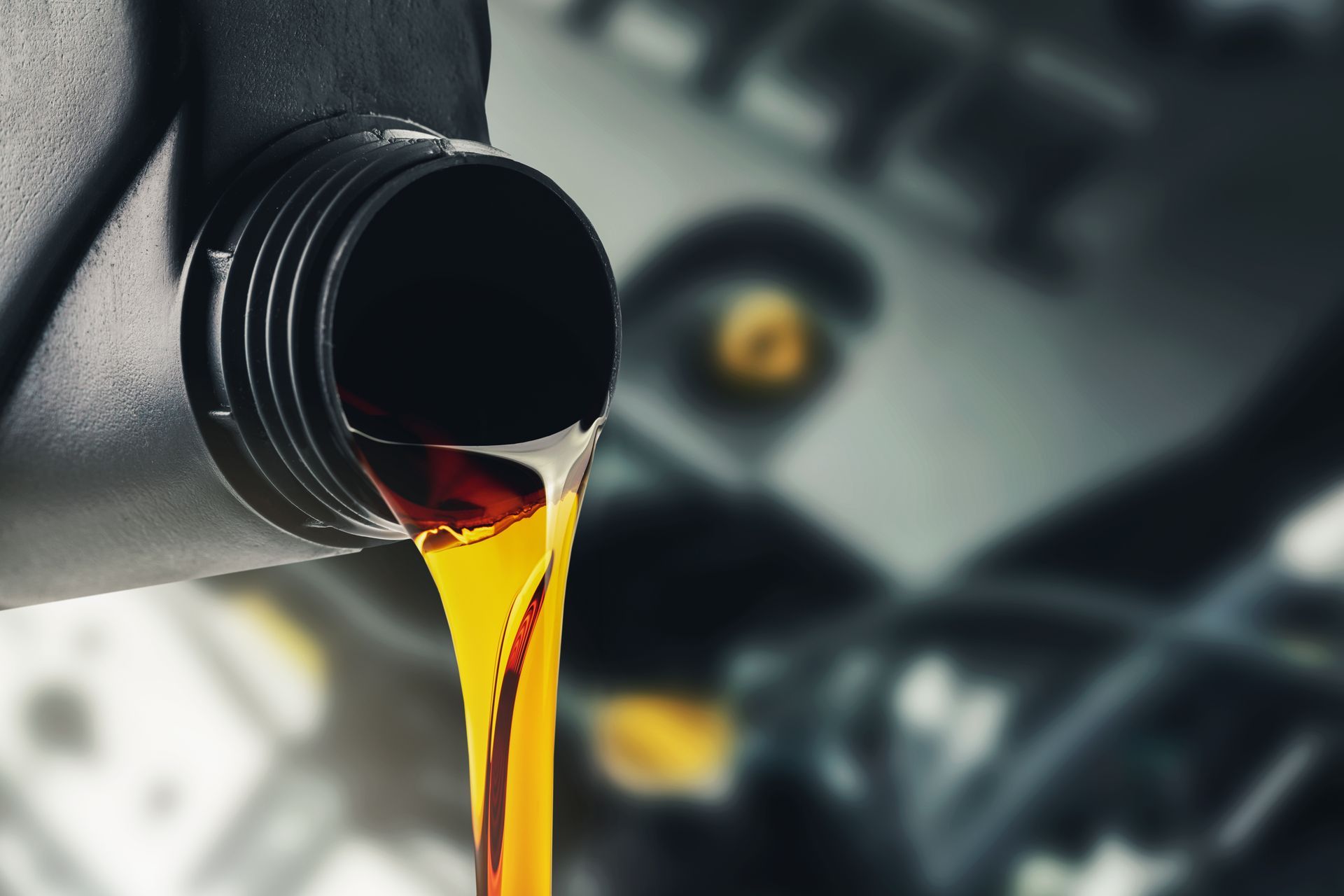 Fluid Being Poured in Engine Image | Snellville Auto Center