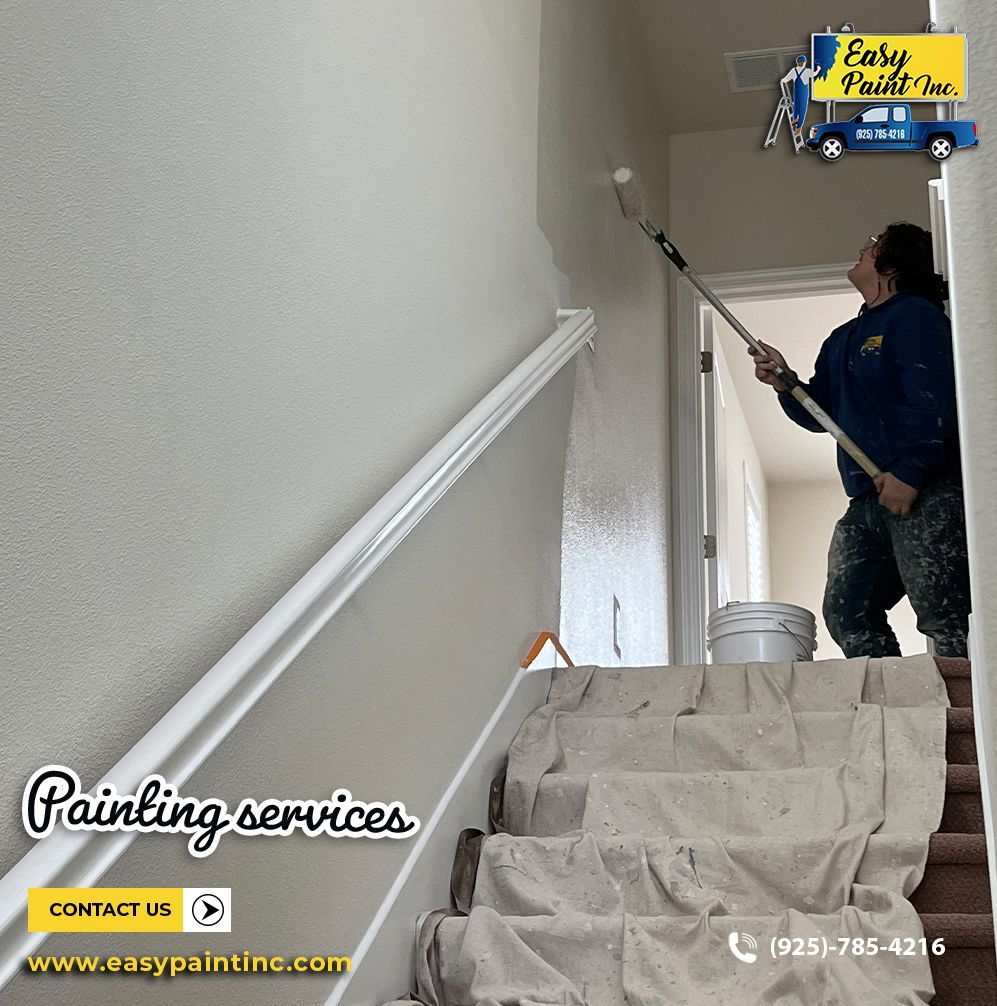 Person painting a staircase wall with a roller. White paint, protective covering on steps. Easy Paint Inc. logo.