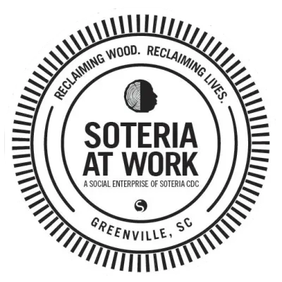 Soteria at Work logo with circular text, “Reclaiming wood, reclaiming lives,” Greenville, SC.