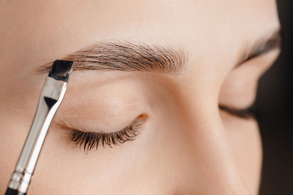 Woman Getting Her Eyebrows Tinted — Paradiso Skin & Beauty Studio in Byron Bay, NSW