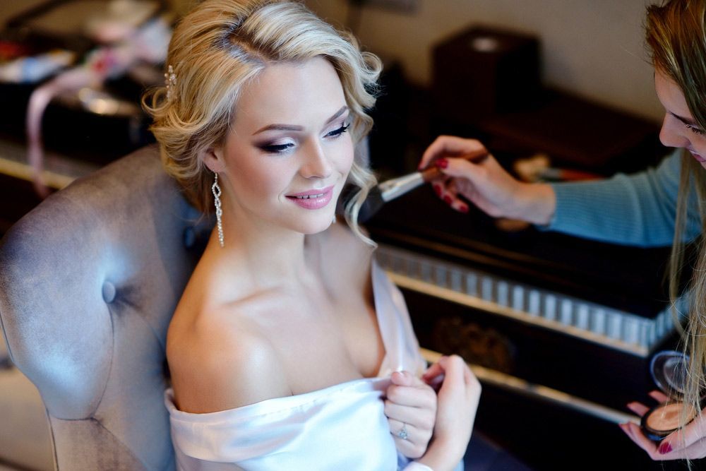 Woman Sitting In A Chair Getting Her Hair &makeup Done — Paradiso Skin & Beauty Studio in Byron Bay, NSW
