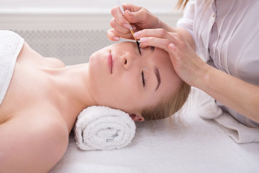 Woman Getting Her Eyebrows Dyed In Paradiso — Paradiso Skin & Beauty Studio in Byron Bay, NSW