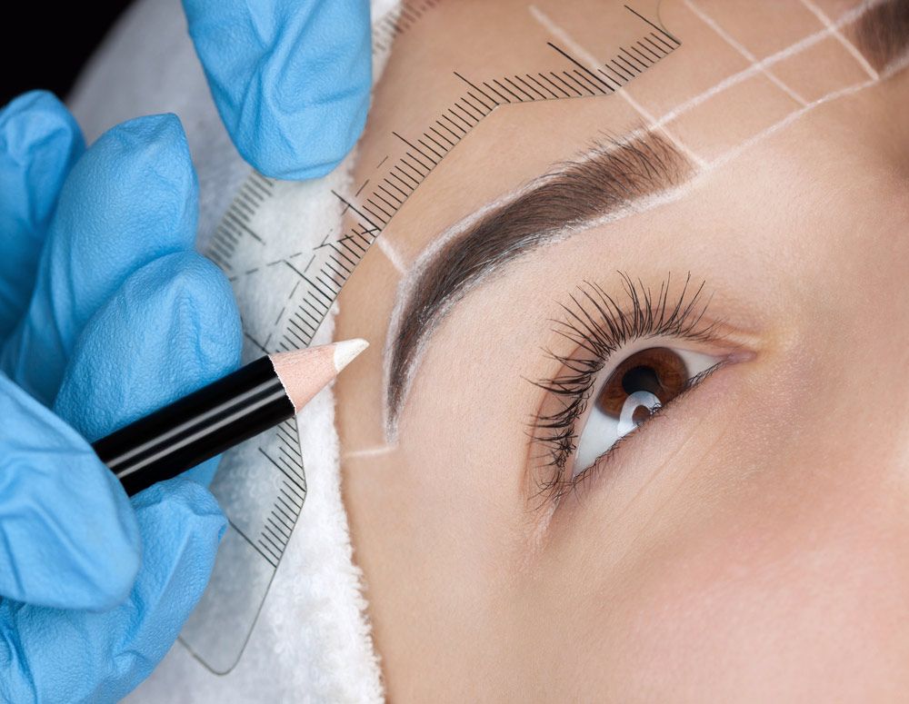 Woman Getting Her Eyebrows Drawn Before Microblading — Paradiso Skin & Beauty Studio in Byron Bay, NSW