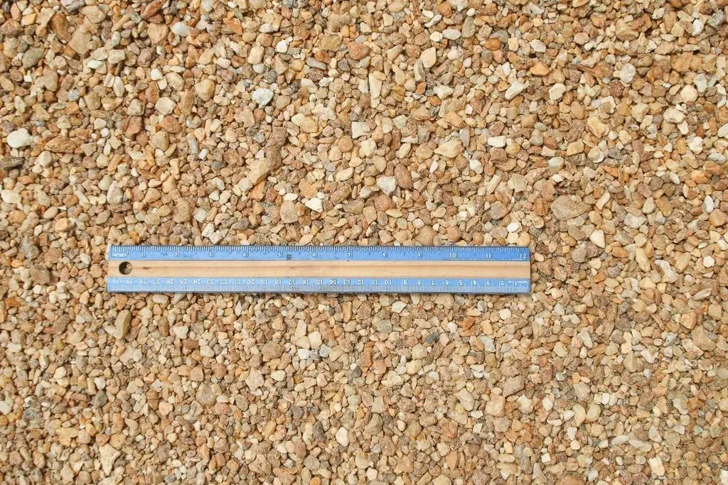 Blue measuring ruler on a corkboard background