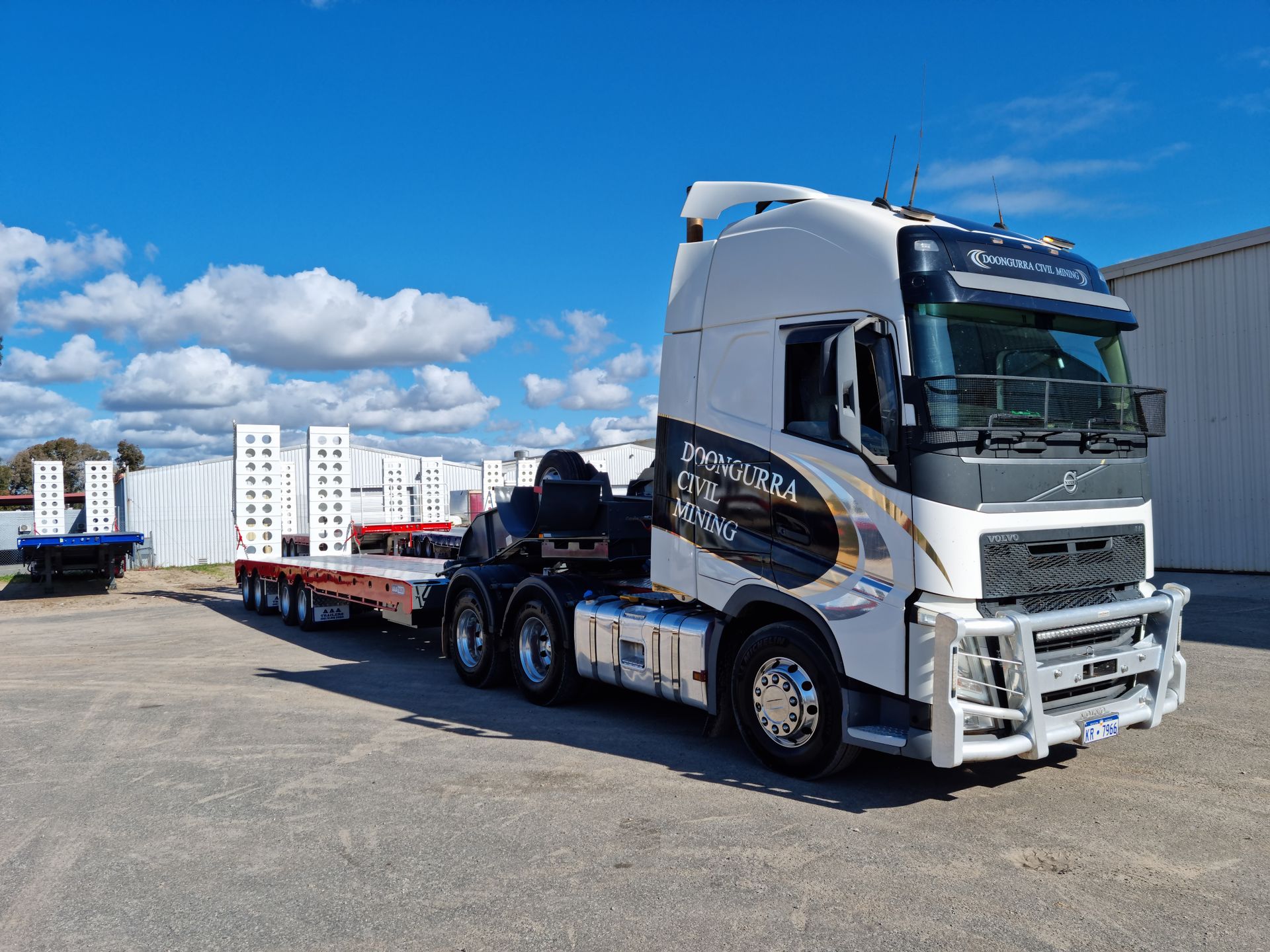 low loader trailer attached to truck