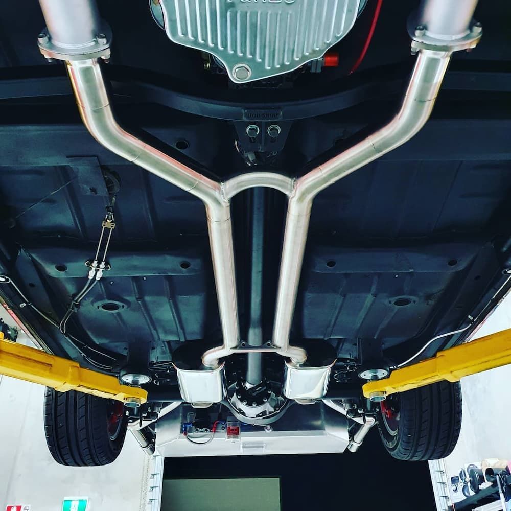 A Close Up Of A Vehicle's Exhaust System — MTM Automotive in Bentley Park, QLD