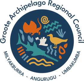 Groote Archipelago Regional Council logo: Blue circle with various stylized sea creatures and symbols. Text around the edge.
