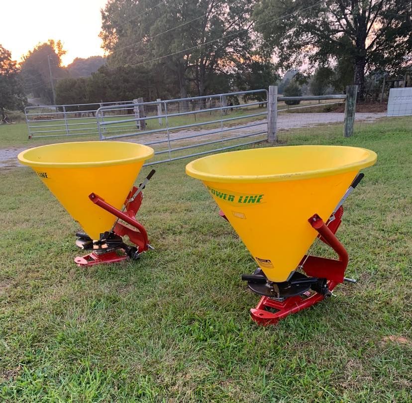 Two yellow planters with the word line on them