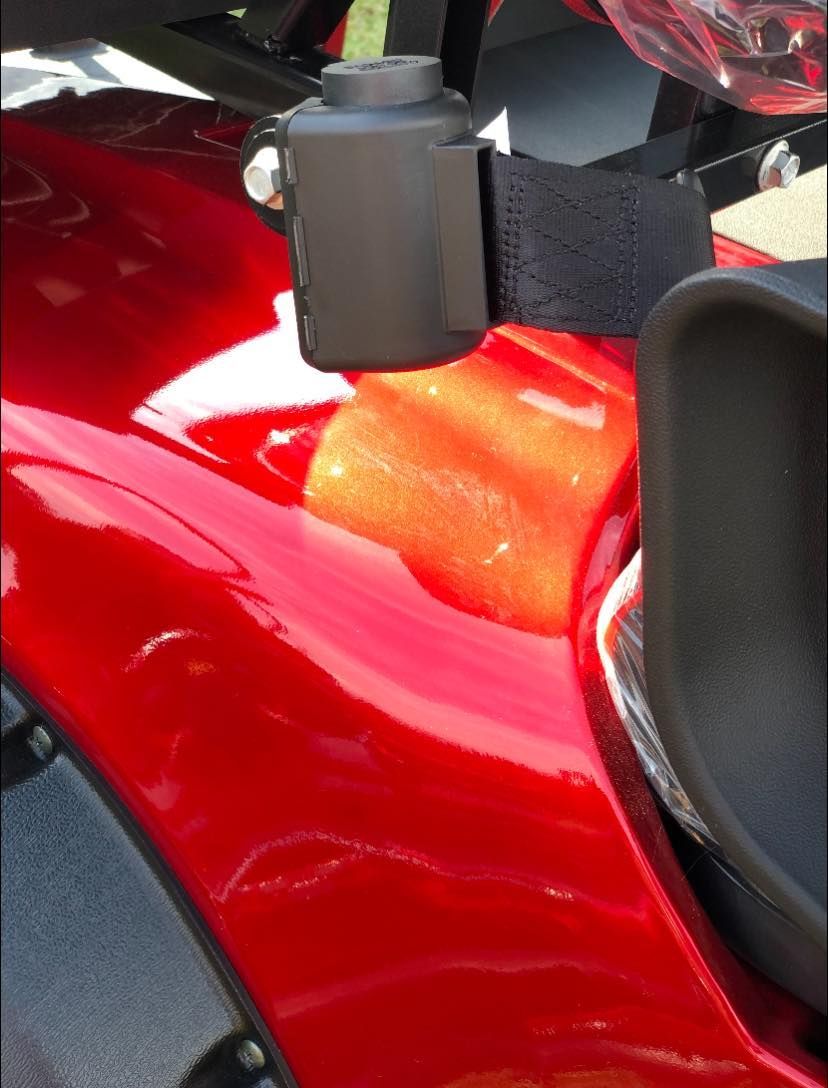A close up of a red motorcycle with a black seat