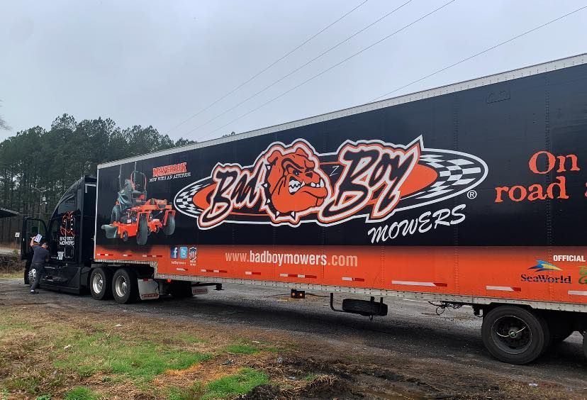 A semi truck is parked on the side of the road.