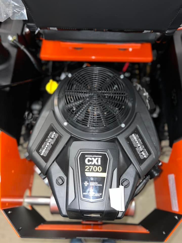 A close up of a cxi 2700 engine on a lawn mower