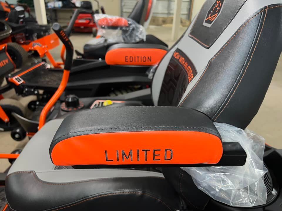 A black and orange chair with the word limited on it