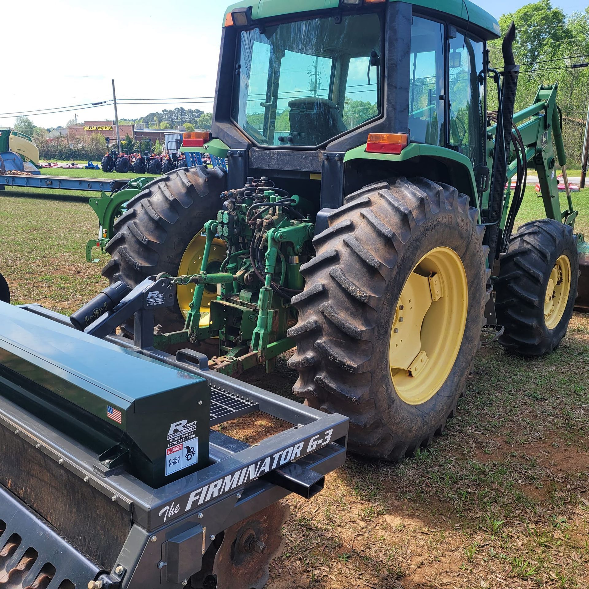 A john deere tractor is parked in a grassy field