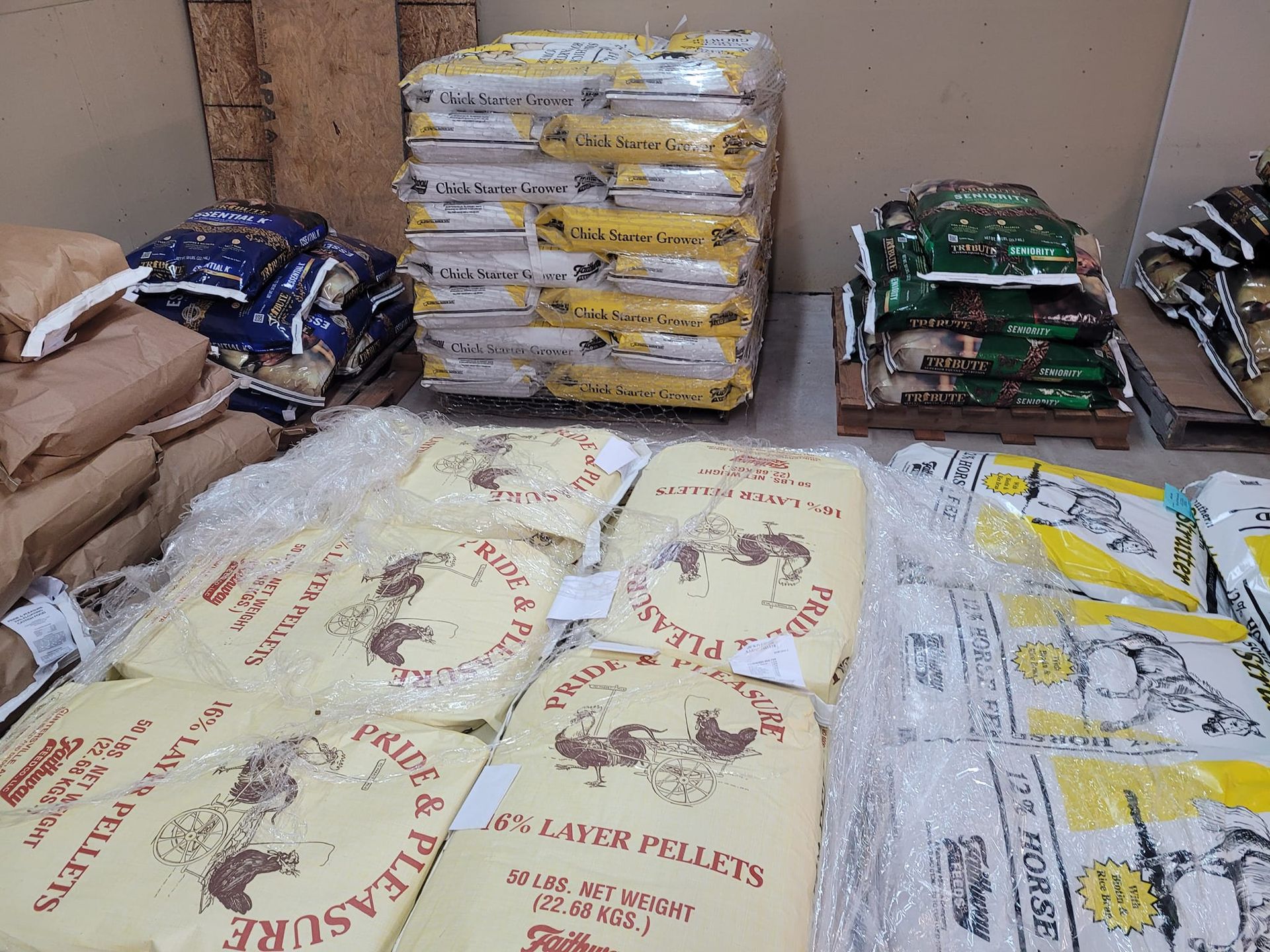 A bunch of bags of food are stacked on top of each other