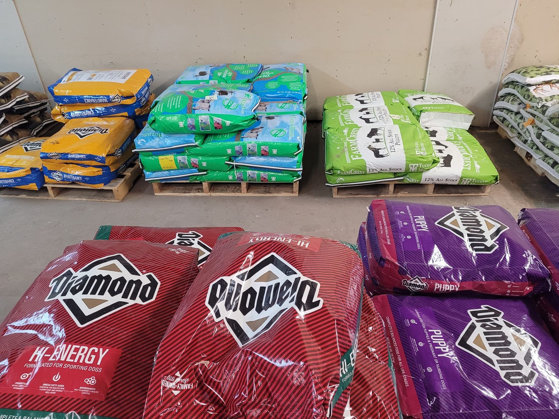 A bunch of bags of food are stacked on top of each other