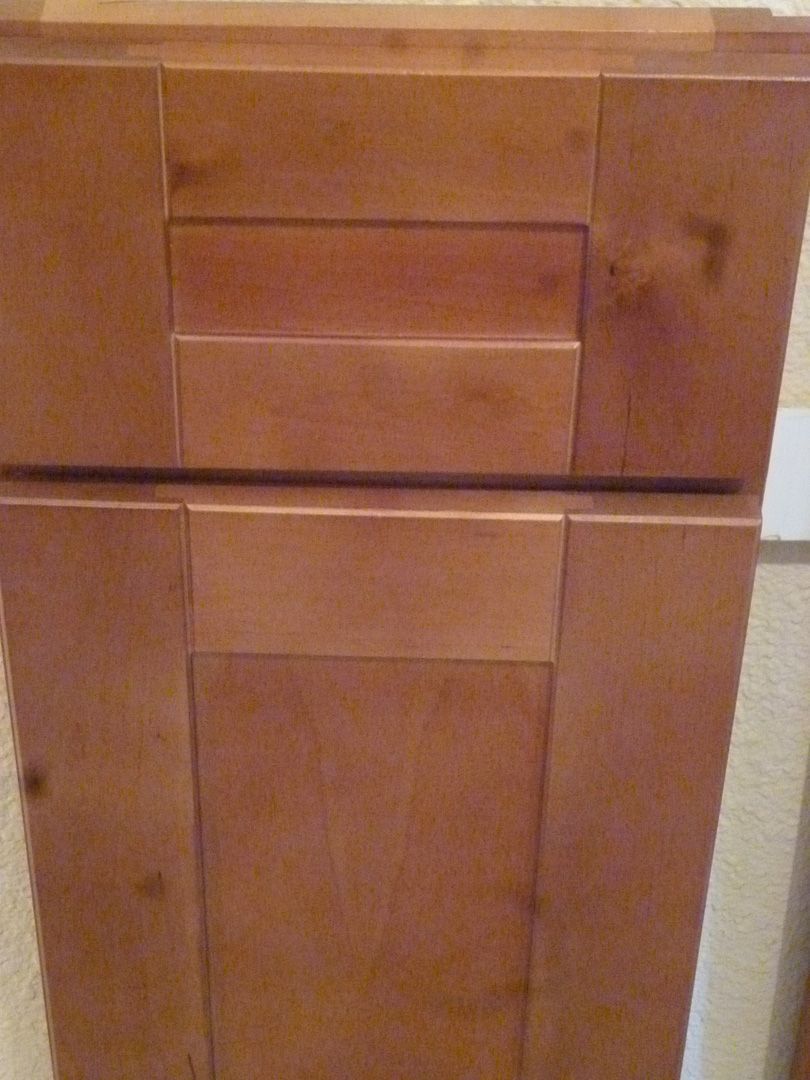 A close up of a wooden cabinet with drawers