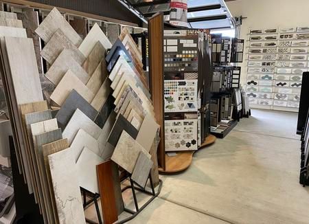 There are many different types of tiles on display in this store.