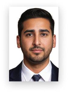 A man with a beard is wearing a suit and tie