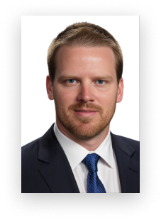 A man with a beard wearing a suit and tie