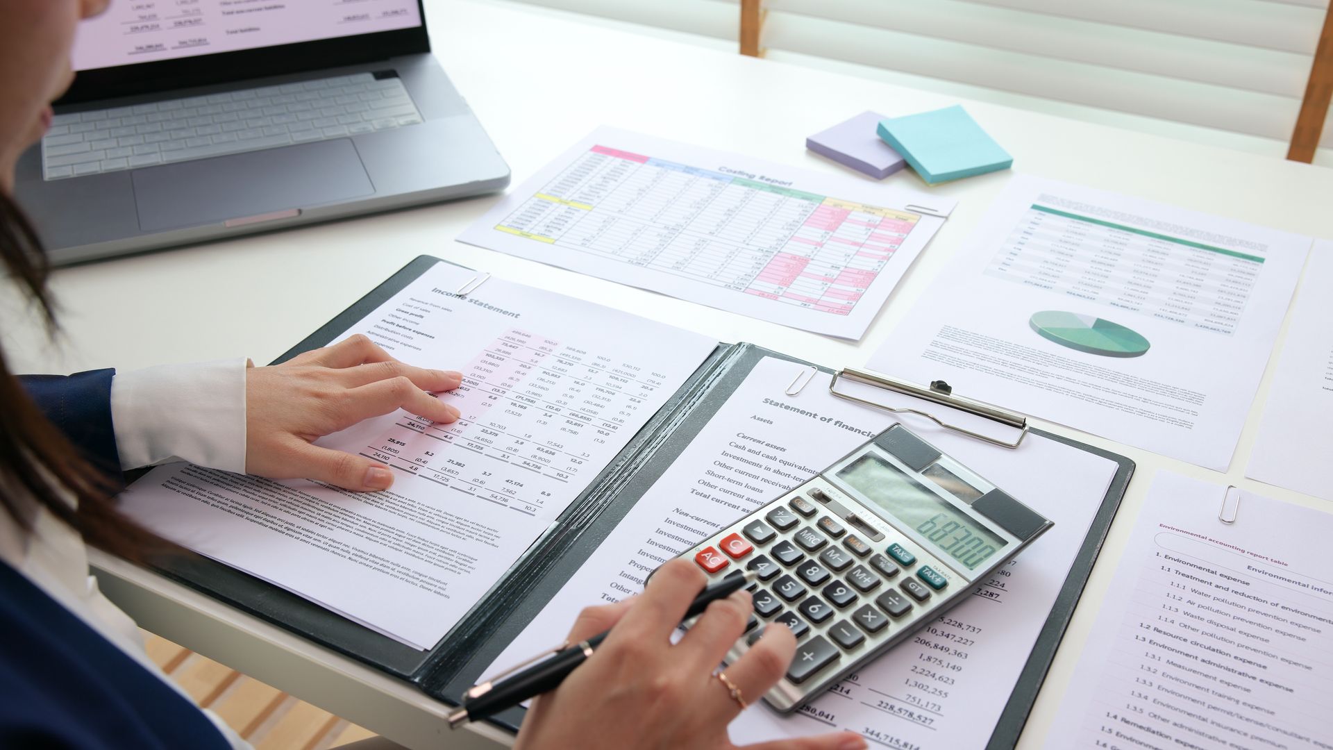 Person working on financial documents 