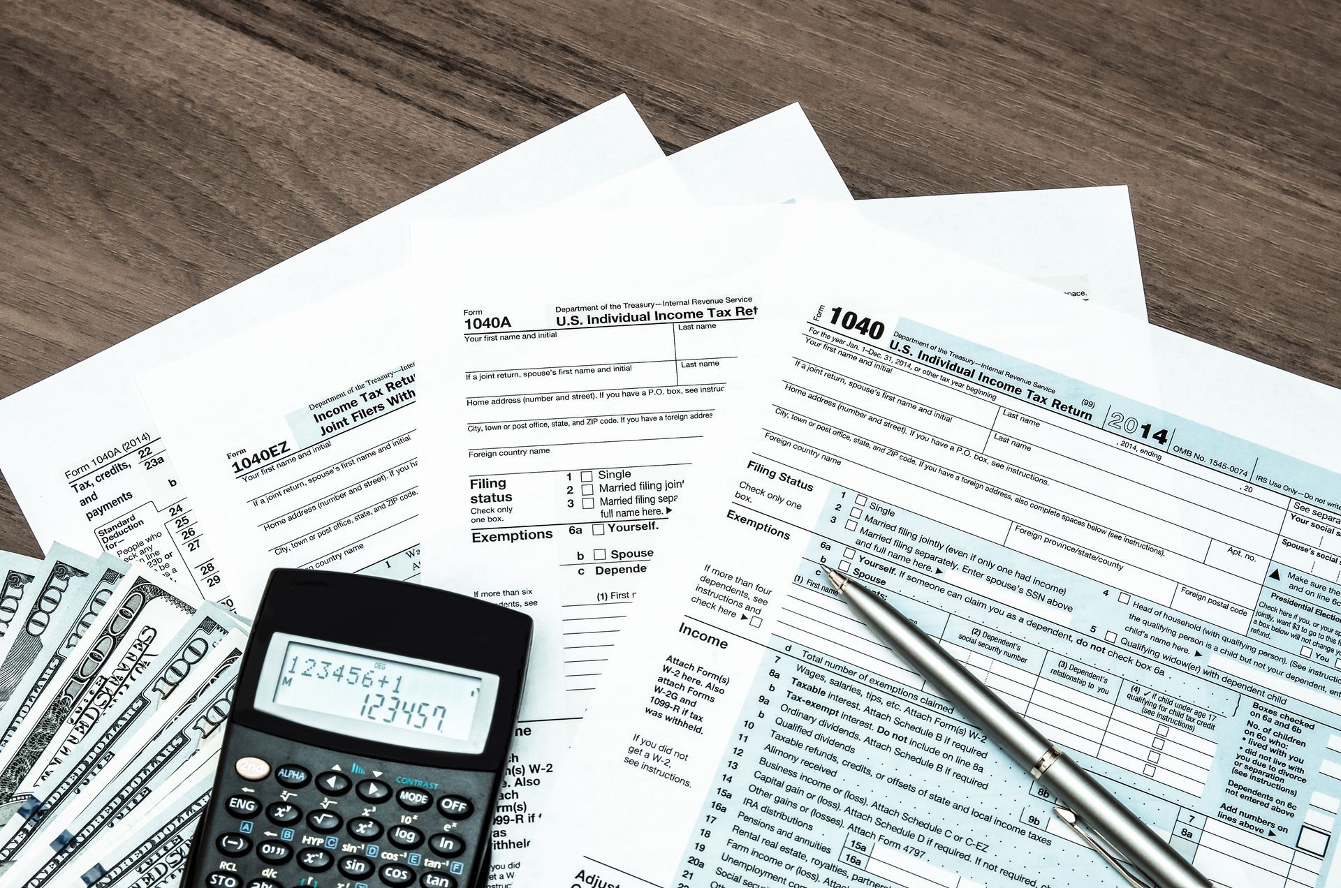 Tax forms, calculator, pen