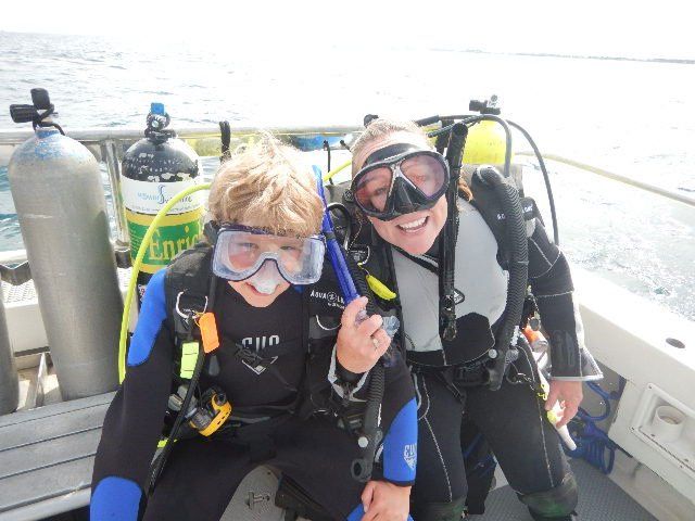 Two People in Diving Suit — Royal Palm Beach, FL — TPowers Swimming