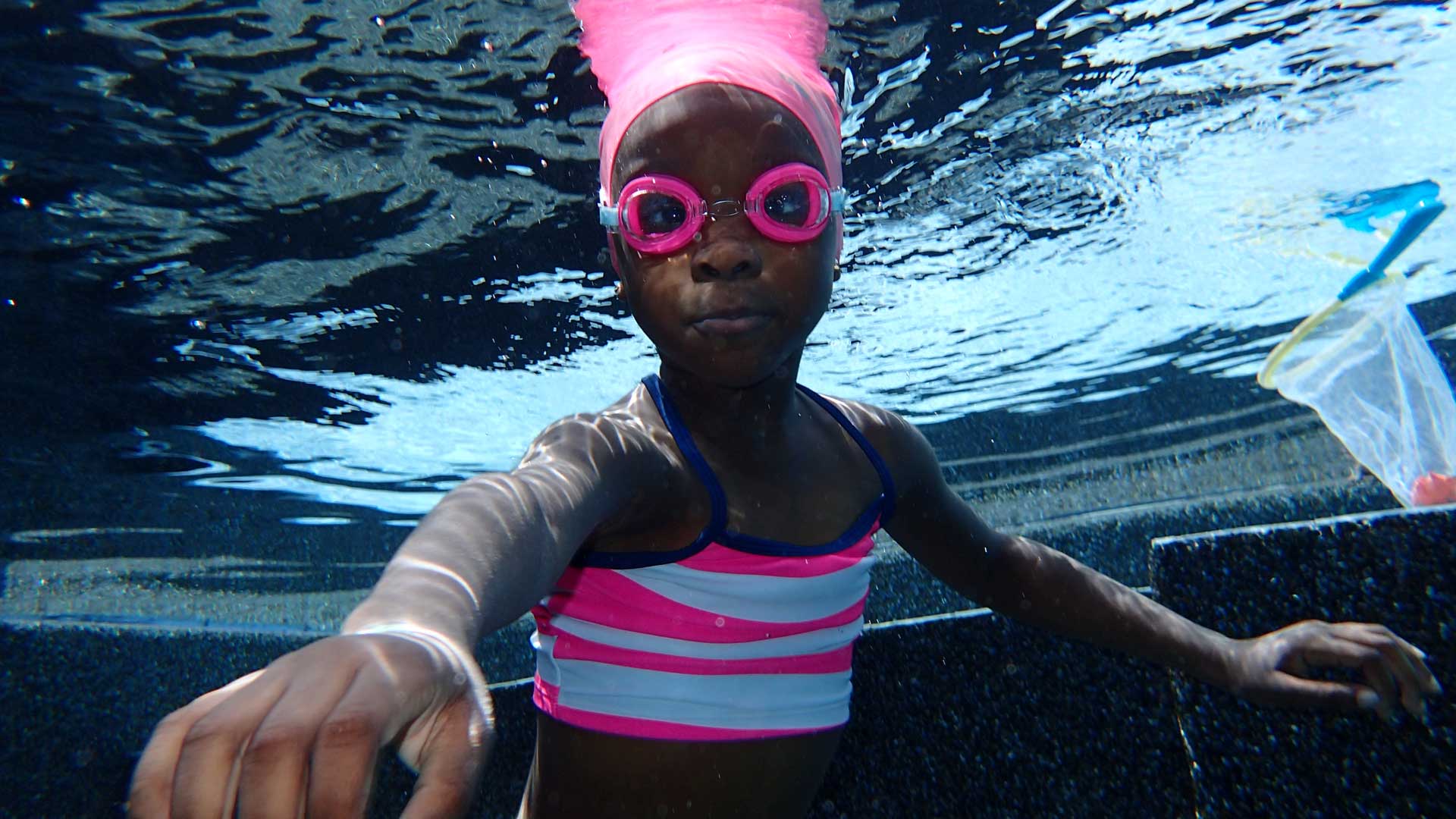 Kid with Pink Goggles — Royal Palm Beach, FL — TPowers Swimming