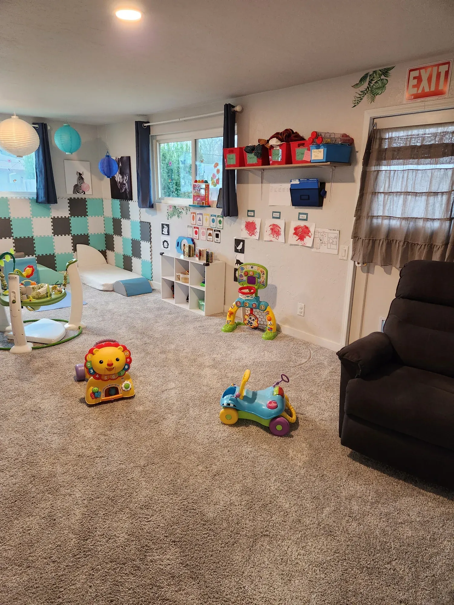 A room filled with lots of toys and a recliner.