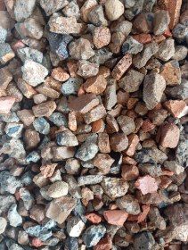 Pile of various-sized, multi-colored gravel, including shades of gray, brown, and red.