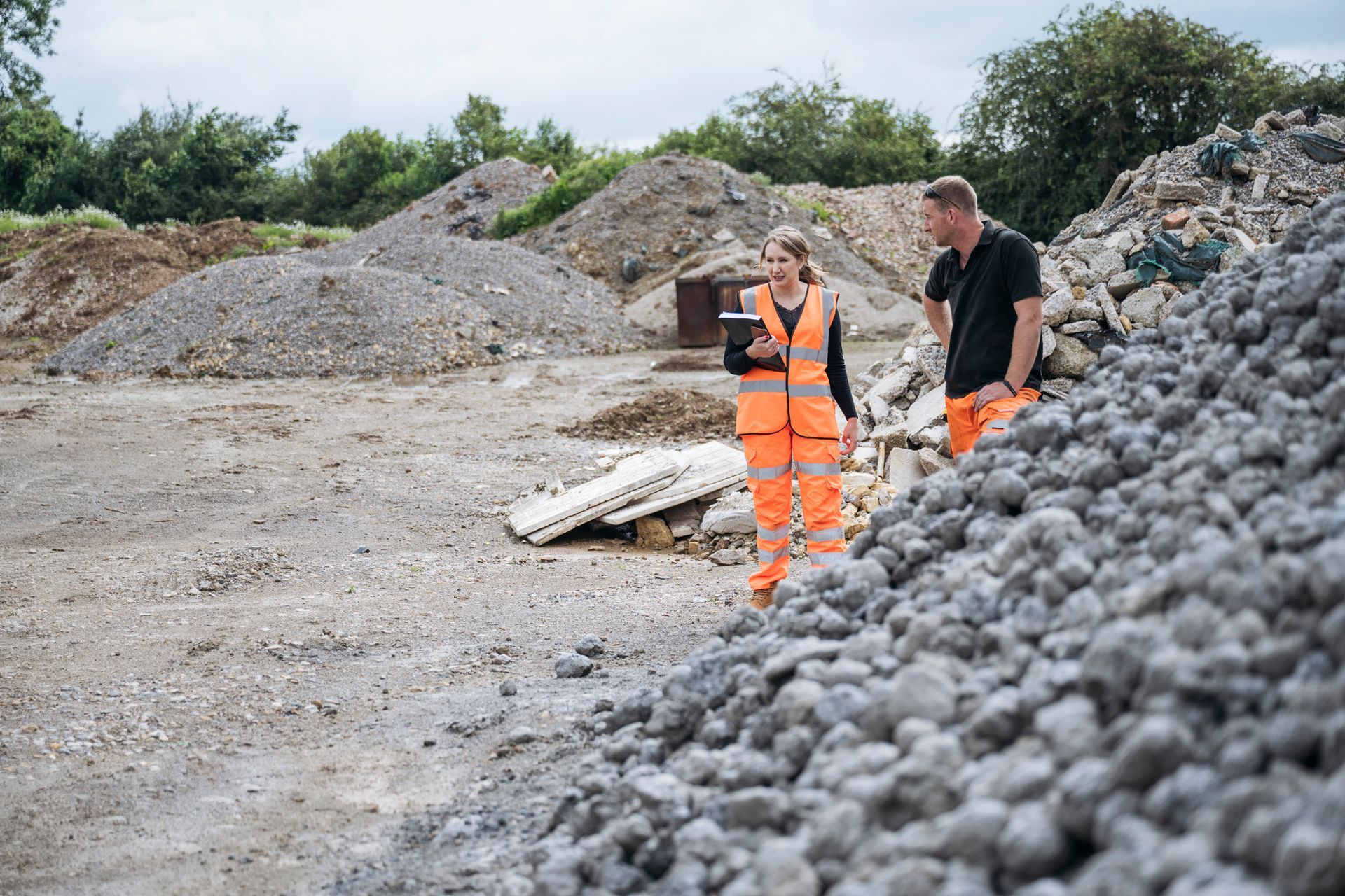 Business partners inspecting construction aggregate - Aggregate Recycling, Recycled Aggregates