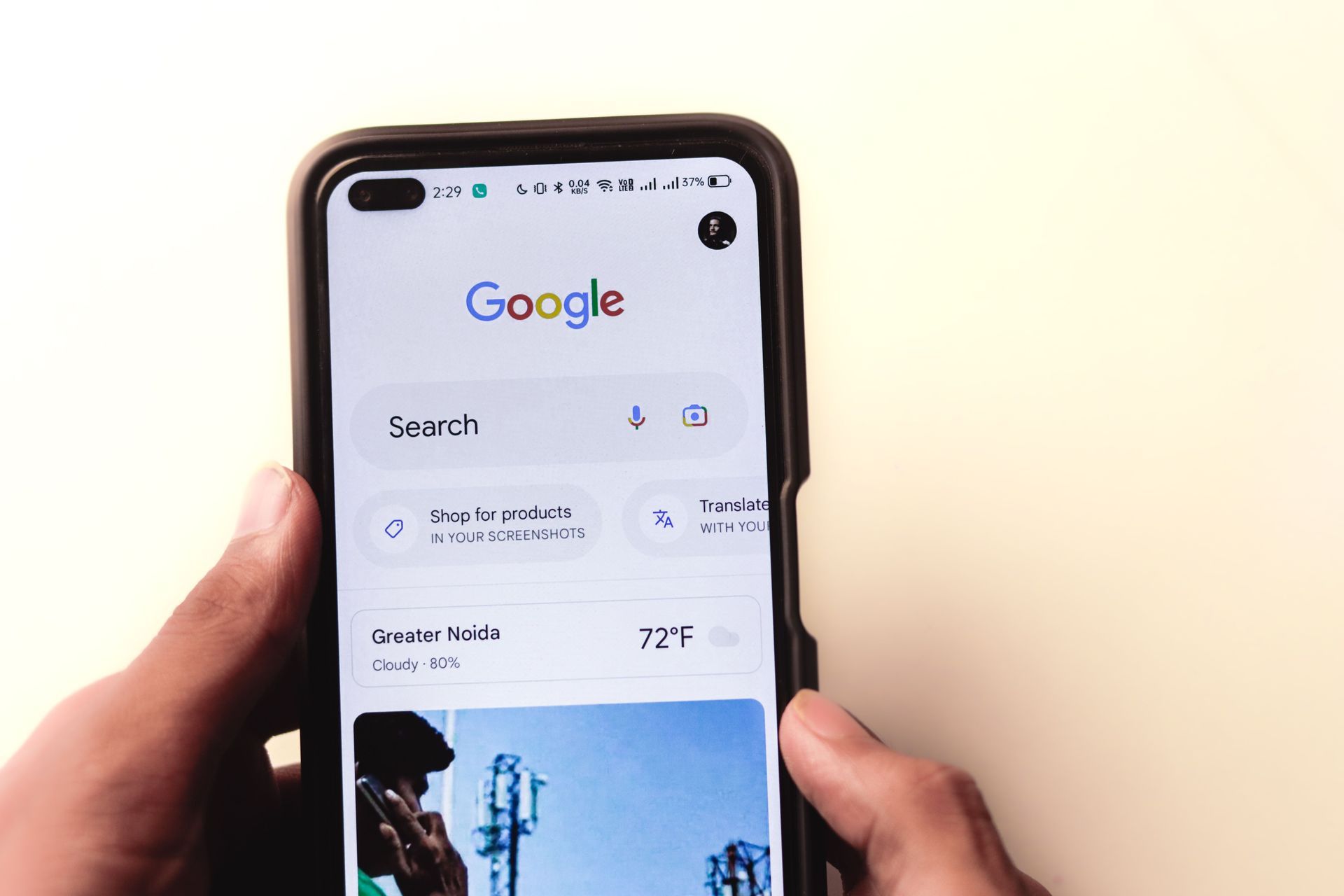 Hands holding a smartphone showing the Google homepage of Google My Business account management by Wilsona Marketing